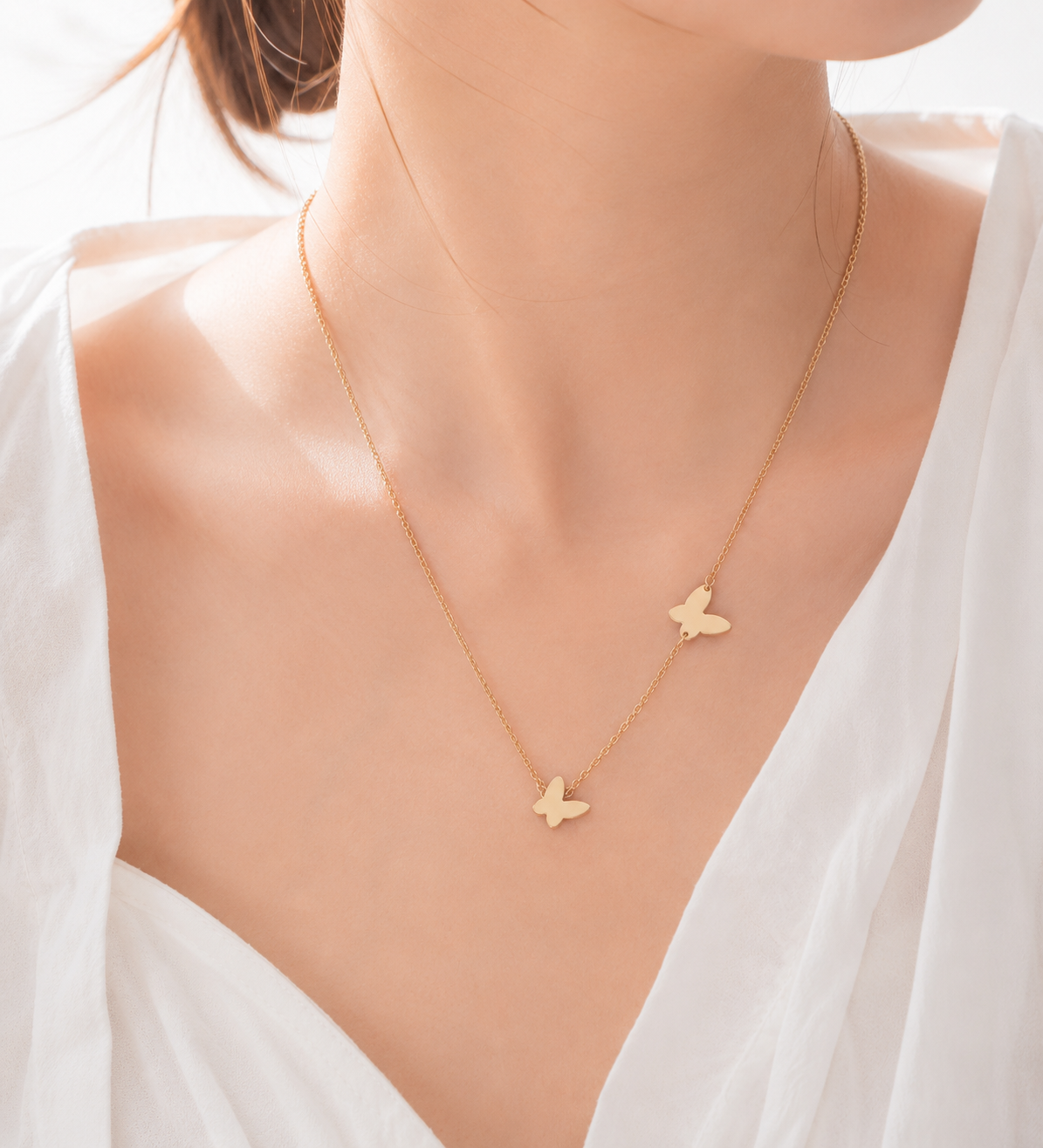 Collier double papillons